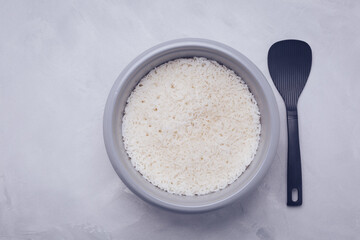 Rice in rice cooker or steamer with spoon