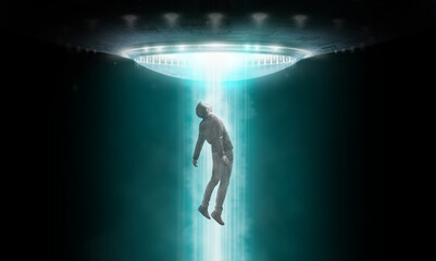 Man being abducted by UFO