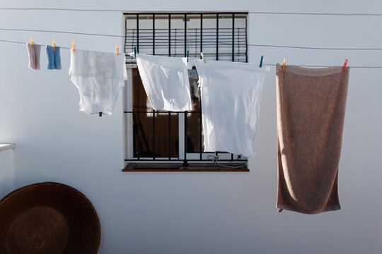 Linen hanging on rope in yard