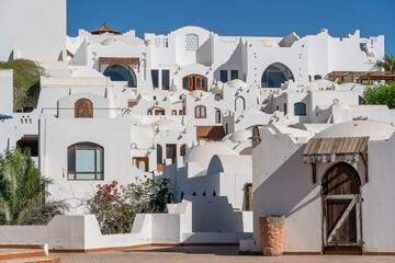 Fototapeta premium White wall buildings and stairs on the street in resort town Sharm El Sheikh, Egypt