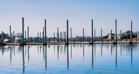 Naklejka premium Abstract geometry of pier poles at the marina in Hyannis Harbor on Cape Cod, Massachusetts