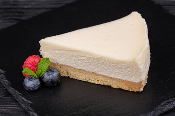 cheese-based cheesecake decorated with almond petals