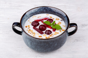 rice porridge with berries, served with mint