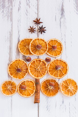 Christmas tree made of dried oranges, cinnamon and anise. Viewed from above.