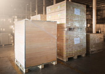 Package Boxes Wrapped Plastic Flim on Pallets at Storage Warehouse. Shipping Warehouse Logistics.	

