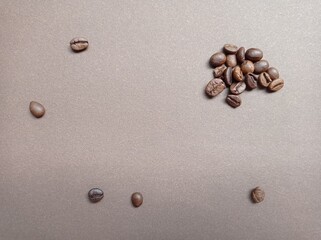 Coffee beans on a brown background. Copy space. Coffee. Background.