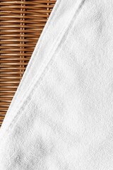 Clean white towels folded on a brown wood table.