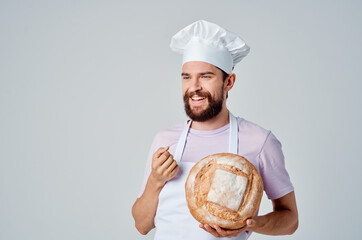 man in chef's uniform work cooking baking service