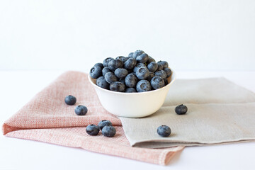 Fototapeta na wymiar Bowl with blueberries. Selective focus. Copy space