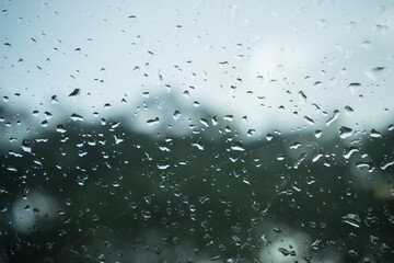 Raindrops on glass walls on cars, rain drops on clear windows or rain droplets on glass of raindrops or vapors of windows
