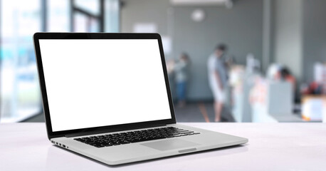 Fototapeta premium Laptop or notebook with blank screen on service counter in blurry background with parcel delivery office express, EMS.