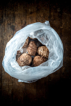 Eddoes in plastic bag on table