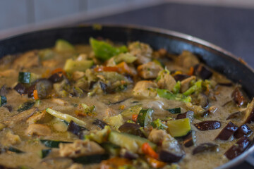 fresh healthy cut vegetables with meat and soap while cooking thai meal