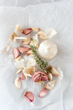 Garlic and herbs placed on table