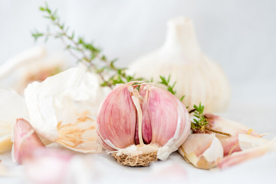 Garlic and herbs placed on table