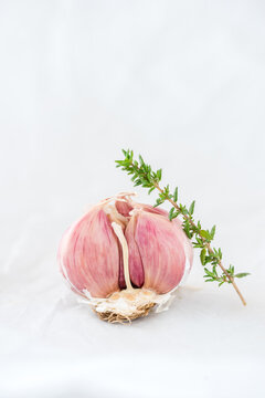 Garlic and herbs placed on table
