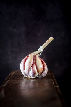 Garlic placed on wooden table