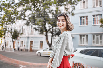 Obraz premium cute blonde girl with red lips outdoors walk lifestyle