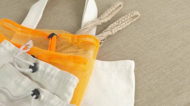 String bags on the table. A view of many string bags on the table. A concept of reusable eco friendly life.