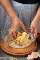 Dough Making, A Female Hand  Preparing Bread Baking Dough in  Clear Bowl in the Kitchen