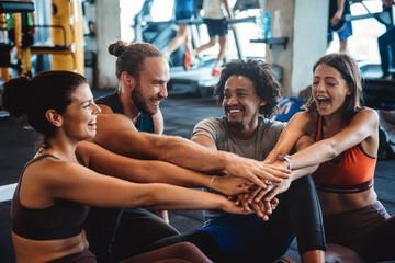 Group of happy people friends working out in gym together