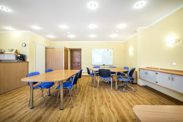 Modern furnished office with office desks and chairs