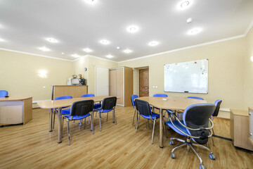 Modern furnished office with office desks and chairs