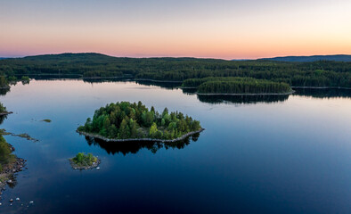 Fototapeta na wymiar Evening panorama on Karelian lake Kovdozero. Settlement Zelenoborsky, Kandalaksha, Murmansk region, Kola Peninsula. Polar day. Karelian landscape