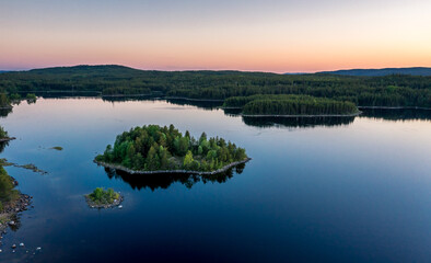 Evening panorama on Karelian lake Kovdozero. Settlement Zelenoborsky, Kandalaksha, Murmansk region, Kola Peninsula. Polar day. Karelian landscape