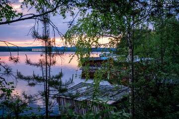 Evening panorama on Karelian lake Kovdozero. Settlement Zelenoborsky, Kandalaksha, Murmansk region, Kola Peninsula. Polar day. Karelian landscape