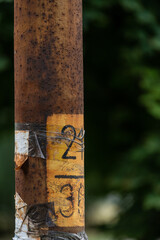 fragment of a rusty metal street lamp