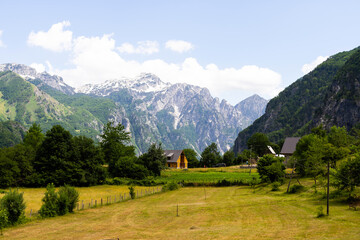Fototapeta na wymiar Mountain landscape with houses and farms in Theth in the Albanian alps
