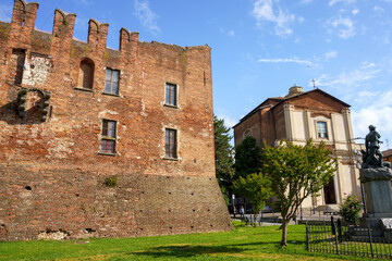 Fototapeta na wymiar Medieval castle in Binasco, Milan, Italy and church