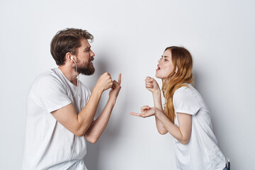 cheerful young couple in white t-shirts communication friendship emotions