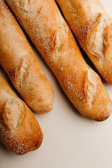 Fresh homebaked delicious baguettes on a white background
