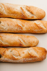 Fresh homebaked delicious baguettes on a white background