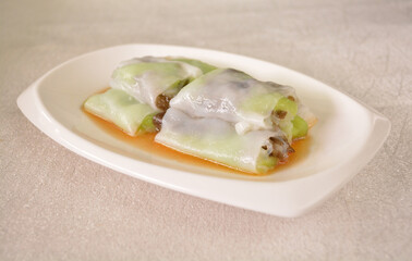 steamed rice vermicelli noodle roll wrapped with char siew prawn meat in salted soy sauce Cee cheong fan asian halal dim sum menu