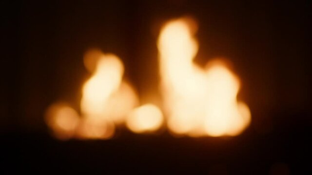 Close up hands holding up glasses of red wine on bonfire background. Concept of cheers ,toast, celebrate.