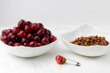 Cherry without pit on a white background. The process of removing bones from cherries