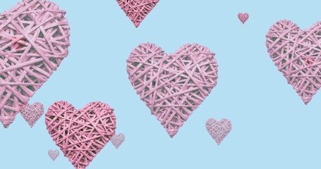 Composition of pink hearts with texture on blue background