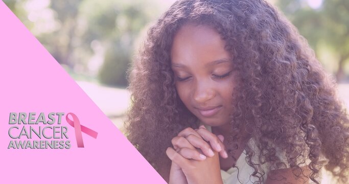 Composition of pink ribbon logo and breast cancer text, with praying schoolgirl
