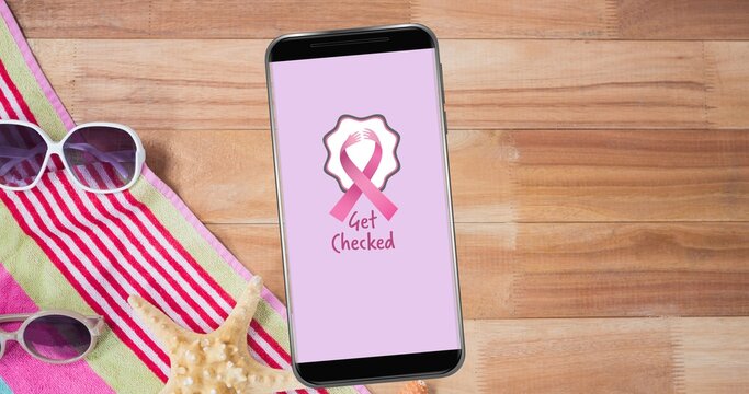 Composition of pink ribbon logo and breast cancer text on the smartphone screen