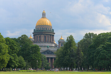 View Cathedral of St. Isaac through the trees of the Alexander Garden.