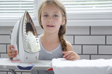 child, iron, baby, kid, flatiron, smoothing-iron, alone, situation, electric, electricity, heat, adorable, beautiful, board, cheerful, childhood, chore, clean, clothes, cute, desk, domestic, dressmake