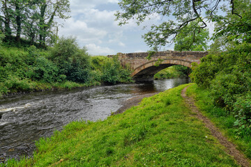 Fototapeta na wymiar Bridge over the river Doon at the Scottish village of Dalrymple