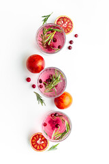 Cold cocktails in glasses with cranberry and blood orange grapefruit