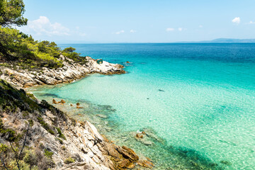 Fototapeta premium Aegean sea coast landscape with aquamarine water, view near Mega Portokali Beach (Sithonia, Chalkidiki, Greece)