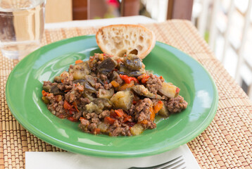 dish of vegetable stew. stewed eggplant, minced meat, carrots, peppers, onion squid