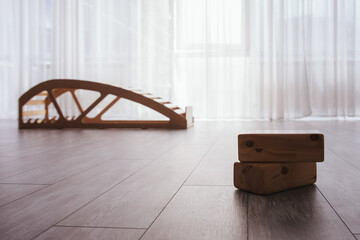 Yoga gym - yoga bench in the background, yoga bricks in focus