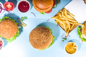 Various burgers set on blue background